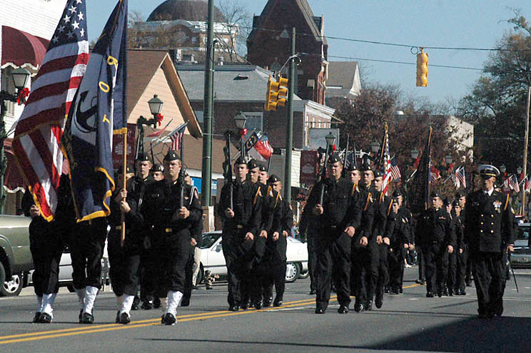 Soldiers walk down the street during a parade